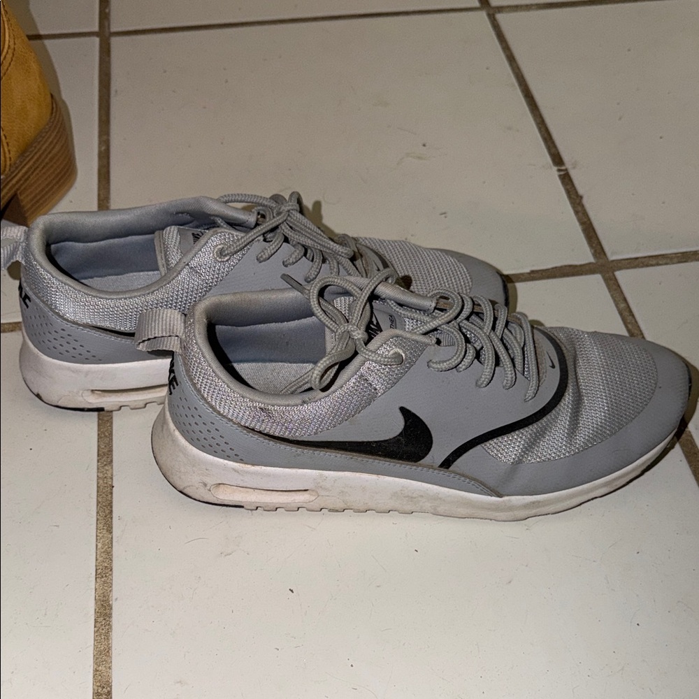 Gray Athletic Sneakers with Black Swoosh